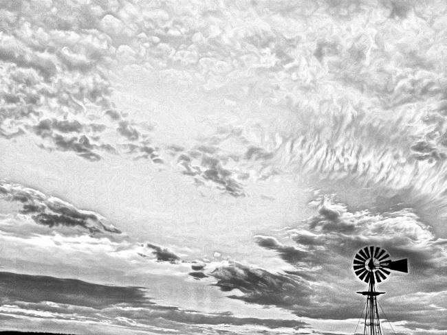 Turbulent sky with windmill